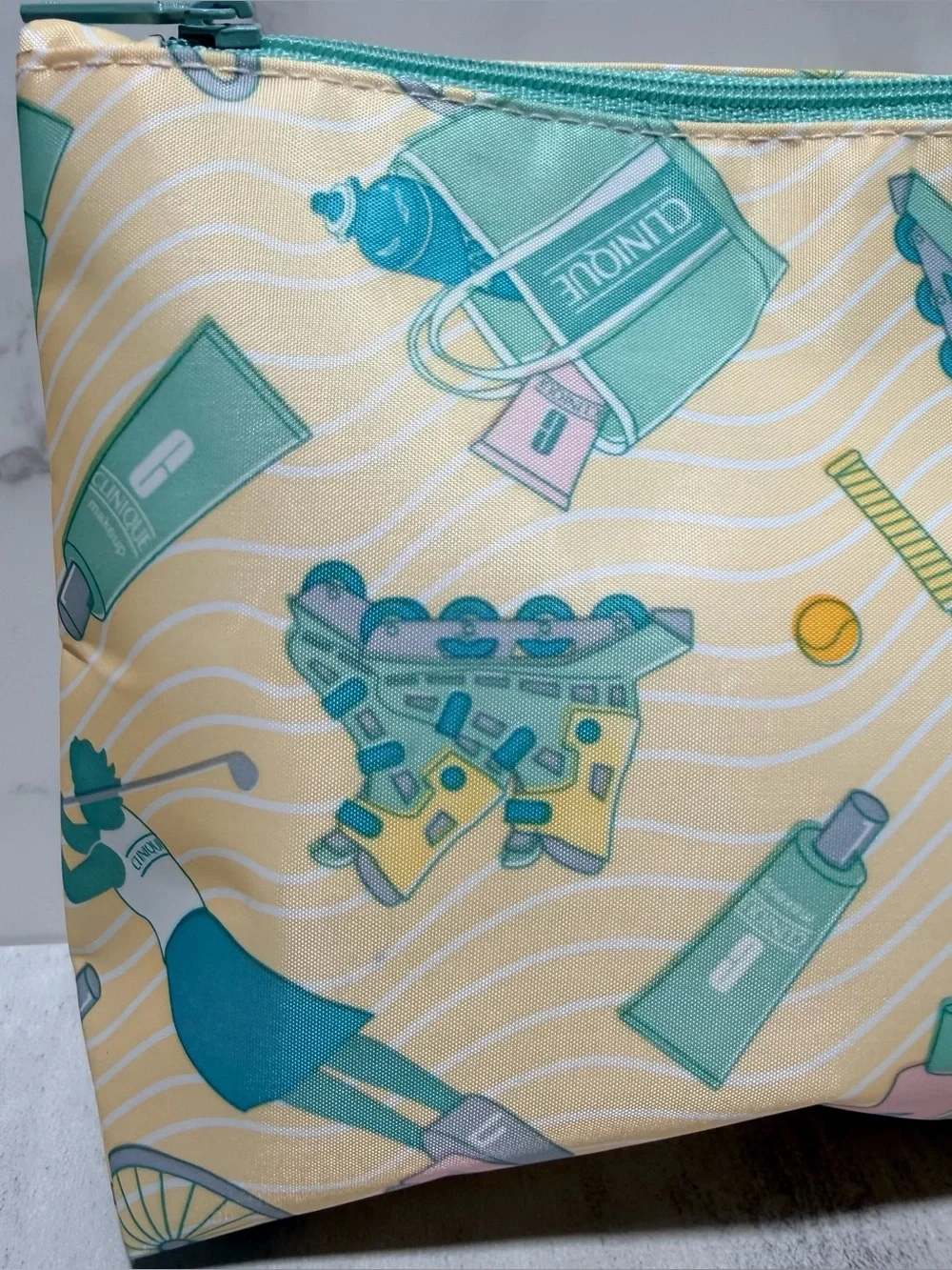 CLINIQUE Yellow & Teal Tennis Graphic Cosmetic Pouch
